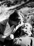 Emil Zatopek and Wife Ingrova Lying Together on the Grass, Smiling