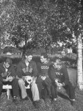 American and Russian Olympic Athletes Sitting on Bench and Talking