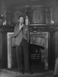 Buy Actor Leslie Howard Smoking Pipe as He Stands by His Fireplace, at Home in Dorking, England at AllPosters.com