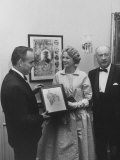 Prince Rainier Iii and Princess Grace Holding a Picture of Themselves