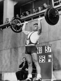 Iranian Weight Lifter M. Namdjou Struggling to Hold Up 206.5 Pound Weight at 1952 Olympics