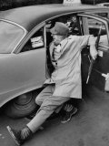 Buy French Actor Jacques Tati Comically Getting Out of a Cab at AllPosters.com
