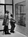French Actor Jacques Tati Looking at the Names of a Building