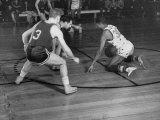 Harlem Globetrotter Marques Haynes Dribbling the Ball While Playing a Basketball Game