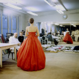 Fashion Designer Christian Dior Commenting on Red Gown for His New Collection Prior to Showing