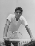 Tennis Star Pancho Gonzalez Poised at Net