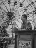 Henry Koerner Standing in Front of Ferris Wheel