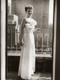 Photographer Margaret Bourke-White, in Evening Dress, Standing on Balcony Holding a Drink