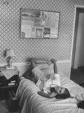 16 Yr. Old Surfer Kathy Kohner Chatting on Phone, Lying on Bed, with Surf Board Riding Friends