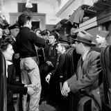 Folk Singer Woody Guthrie Performing for Small Group Aboard a Train