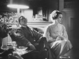 Director Sidney Lumet Sitting W. His Wife Gloria Vanderbilt at Reception