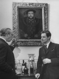 Actor Robert Donat Standing Holding Drink with Alexander Korda under Portrait of Henry Viii