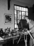 Artist Charles Sheeler Photographing a Still Life Scene to Be Painted Later