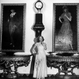 Buy Actress Marion Davies, Standing under Two Portraits at Home at AllPosters.com