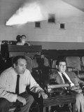 Film Director Val Lewton Watching Scenes with Others in a Film Viewing Room