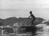 16 Yr. Old Surfer Kathy Kohner Riding a Wave