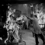 Actor Vincent Price Putting Out Fire in Film 