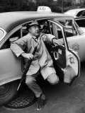 Buy French Actor Jacques Tati Comically Getting Out of a Cab at AllPosters.com