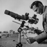 Life Photographer Ralph Crane Using a Bushnell Spacemaster Lens Attachment to Take Telephotos