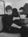 French Singer Genevieve Giving Her Poodle a Hug