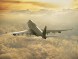 Jumbo Jet Above Clouds at 35,000 Feet