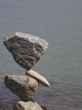Rocks Balanced by a Man on the Shore of San Francisco Bay, California, USA