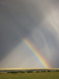 Buy A Rainbow Moves across Hermit Basin Near Westcliffe, Colorado in a Rainstorm at AllPosters.com