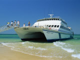 Tourists Boarding Large Catamaran on Beach Near Rockhampton, Queensland, Australia, Pacific
