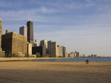 Walkers on Ohio Street Beach with City Skyline Behind, Chicago, Illinois, USA