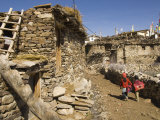 Two Schoolchildren and Typical Stone Houses on Village Street, Nako, Spiti, Himachal Pradesh, India