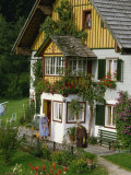 Two Ladies Outside a Typical House in the Salzkammergut Area of Austria