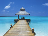 Young Woman Sitting on Bench at the End of Jetty, Maldives, Indian Ocean