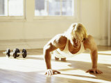 Young Man Preforming Push Up Exercise in Gym, New York, New York, USA