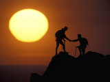 Two Climbers Reach the Summit at Sunrise, Colorado, USA