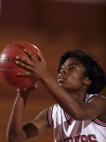 Female High Schooll Basketball Player in Action Shooting a Free Throw During a Game