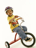Portait of Four Year Old Boy on His Tricycle