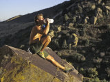 Male Rock Climber Drinking During a Rest Break, USA