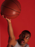 Male Basketball Player Goes Up for a Shot