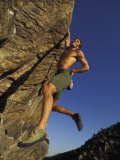 Rock Climber Hanging from Grip