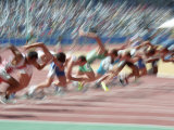 Blured Action at the Start of a Mens 100 Meter Track and Field Race