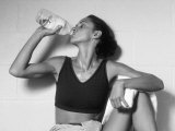 Women Drinking after Exercise Session in Fitness Studio, New York, New York, USA