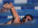 Male Swimmer Competing in a Freestyle Race Photographic Print