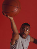 Male Basketball Player Goes Up for a Shot