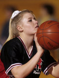Female High School Basketball Players in Action Shooting a Free Throw During a Game