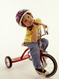 4 Year Old Boy Posing on His Tricycle, New York, New York, USA