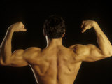 Young Adult Male Posing with Arms Flexed