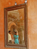 Indian man and woman reflected in mirror, Amber Fort, Jaipur, India