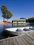 Skiff and boathouse at Oliver Lodge on Lake Winnipesauke, Meredith, New Hampshire, USA
