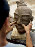 Sculptor Shapes a Reproduction of a Terracotta Soldier