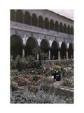 Man Crouches in the Garden Outside of Cuzco's Santo Domingo